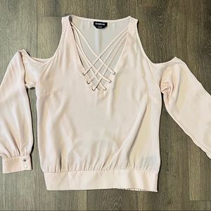 Women’s pink Bebe open shoulder top. Cinches at bottom and pretty detail at top.